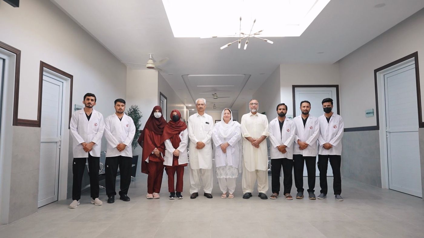 The Foundation's doctors, nurses and staff standing together in the main corridor